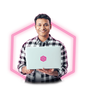 Ethisham-neon man smiling in front of laptop-2