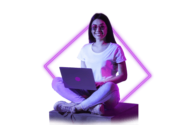 Priscila - neon woman with glasses sitting smiling in front of laptop 2022-05 (1)