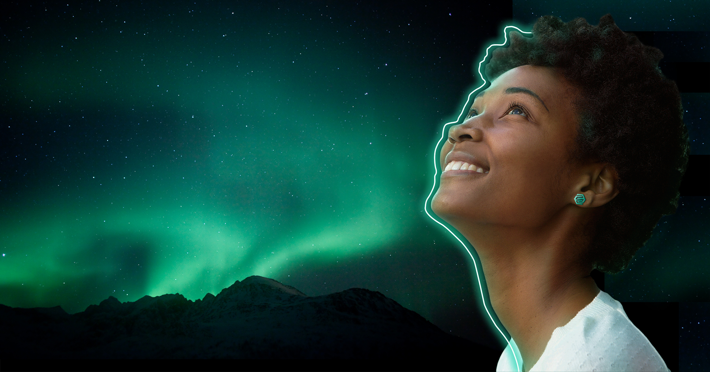 girl looking up into aurora borealis green no text